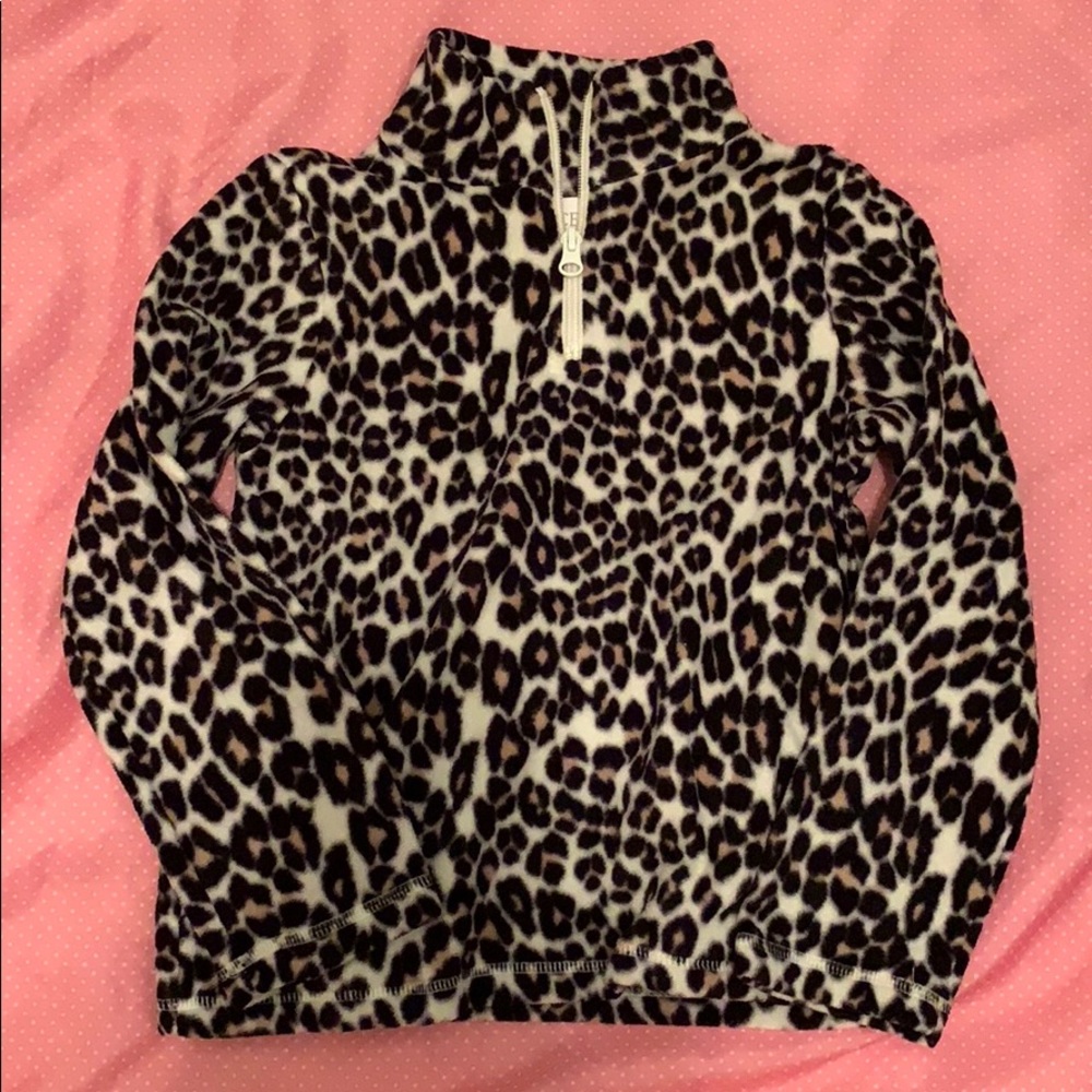 A kids cheetah zip up pull over sweater.